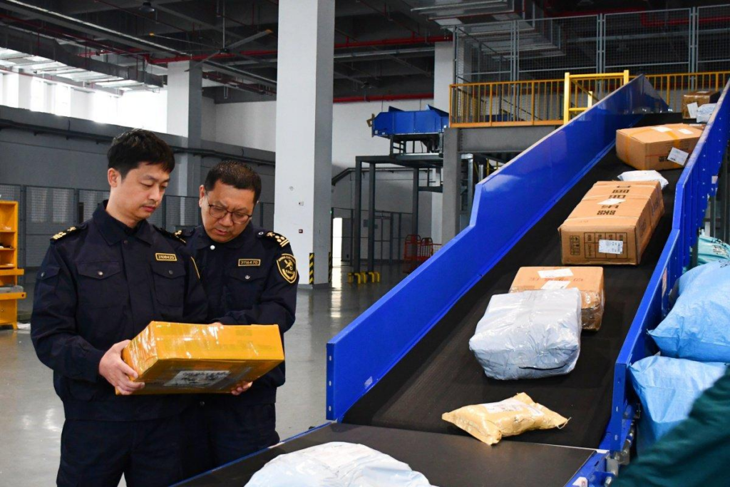 Customs officers inspecting an international parcel before import clearance