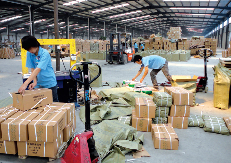 Multiple supplier parcels being prepared for consolidation and repacking in a China warehouse